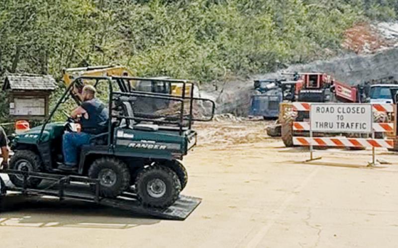 Members of Graham County Fire and Rescue unload a side-by-side to aid in a rescue operation at Stecoah Gap on Saturday. Photo courtesy of Graham County Fire and Rescue