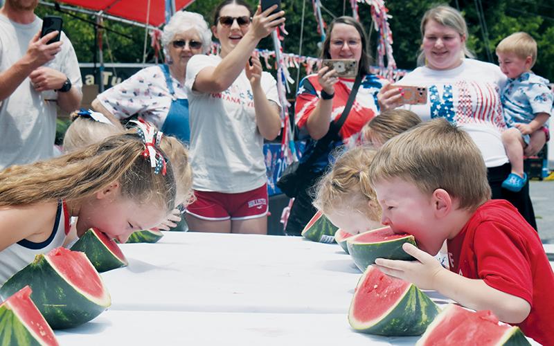 Parents and family members alike cheer on the 0-5 age group during Satuday's watermelon-eating contest, which was held as part of the Graham County Heritage Festival. Photo by Bella Eddings/The Graham Star