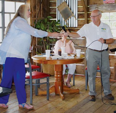 Michelle Shiplet (left) is introduced as the new executive director of GREAT (Graham Revitalization Economic Action Team) by former director Rick Davis at the Sept. 19 meeting. Photo by Art Miller/amiller@grahamstar.com