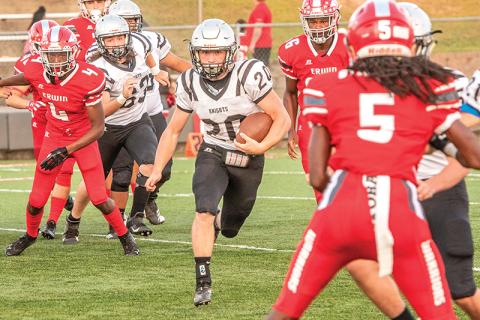 Robbinsville's Lex Hooper (20) quickly reminded Erwin and any future opponents that there is more than one dangerous running in the Black Knights' backfield Friday night, as he caught the Warriors defense completely off-guard on the first play of the game and easily found some open room for a 65-yard touchdown as a result. Photo by Byron Housley/The Graham Star