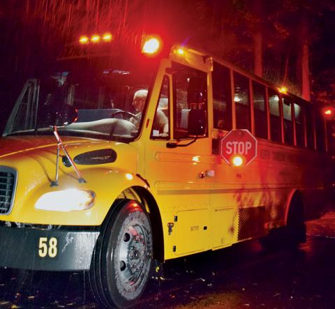 Operation Stop Arm is a week-long initative that sees officers crack down on those who offend school bus laws. Even on a rainy Tuesday morning, drivers like Bobby Howell has to make sure each student he picks up arrives at school safely. Photo by Art Miller/amiller@grahamstar.com