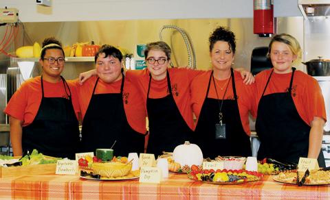 Robbinsville High School students and faculty showed off its new culinary classroom during a recent open house. From left is Brianna Bailey, Jeremiah Jumper, Danielle Bollinger, instructor Lorie Waldroup and Christina Lancaster. Photo by Annette Ensley/Contributing Photographer