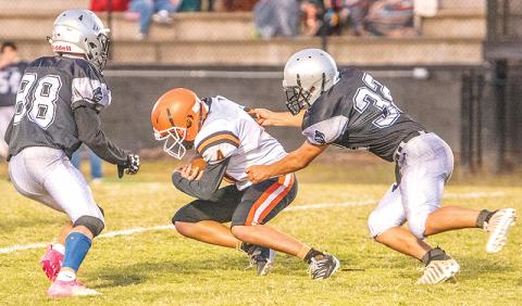 Junior varsity Black Knights Brock Adams (88) and Anjalo Fierro (32) close in on a Rosman runner during the Oct. 17 season finale. Photo by Byron Housley/The Graham Star