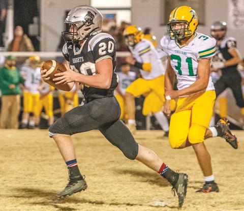 Even Alleghany defensive back Lucas Wigg (31) could not slow down Robbinsville’s Lex Hooper on Nov. 21. The Knights’ running back scored three touchdowns in a 40-22, second-round playoff win over the Trojans. Photos by Byron Housley/The Graham Star