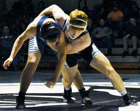 Robbinsville’s Jacob Hall muscles his T.C. Roberson opponent down to the mat during Nov. 26’s 152-pound bout. Photo by Kevin Hensley/editor@grahamstar.com
