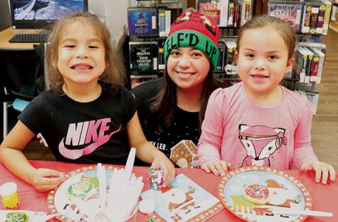 Bennett Brown (left) and Woodleigh Welch worked with Kari Beth Holloway (center) to create the perfect Christmas cookie at Snowbird Community Library’s Cookie and Ornament Decorating Party on Dec. 10. Photo by Zena Rattler/Contributing Photographer