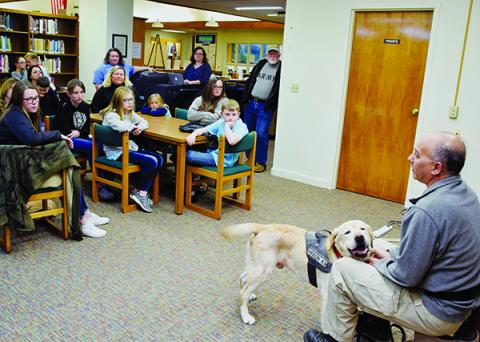 Dean Castaldo and his arson companion Dante (right) present a Fire Prevention Class at the Graham County Public Library on Monday. Photo by Art Miller/amiller@grahamstar.com