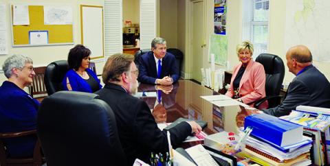 North Carolina Governor Roy Cooper and an aide get acquainted with (from left) ARC Community Development Planner Ann Bass, Clerk of Court Tammy Holloway, Commissioner Connie Orr and Robbinsville Mayor Steve Hooper during his visit to Graham County on April 12. Photo by Art Miller/amiller@grahamstar.com