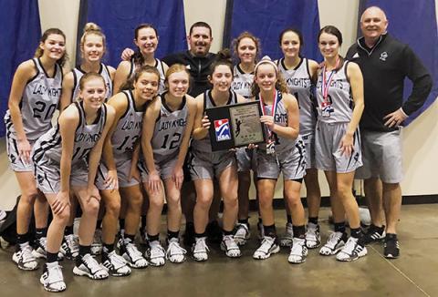 The Robbinsville Lady Knights clinched the 2019 KSA Christmas Tournament championship Monday in Orlando. Front row (from left) are Kandace Holder, Lina Pagan, Ava Barlow, Gabby Hooper and Desta Trammell. Back row (from left) are Yeika Jimenez, Kensley Phillips, Karlyn Matheson, head coach Lucas Ford, Halee Anderson, Kennedy Cable, Cambrie Lovin and assistant coach Mitch Beasley. Photos by Brandon Lovin/Contributing Photographer