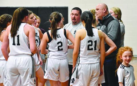 Lady Knights head coach Lucas Ford speaks to his team during a timeout Monday against Murphy. Photos by Kevin Hensley/editor@grahamstar.com