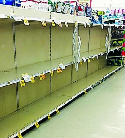 Those in need of toilet paper Tuesday morning would have walked into Robbinsville’s Ingles and found an all-too-familiar site; empty shelves, as customers do their best to stockpile supplies in the wake of the recent coronavirus outbreak. Photo by Hope Riddle/lineads@grahamstar.com
