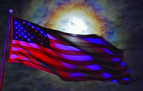 Timing is everything, as the sun illuminated this U.S. flag at Fontana Dam to create a true “Awe-Inspiring Sight.” Photo by Art Miller/amiller@grahamstar.com