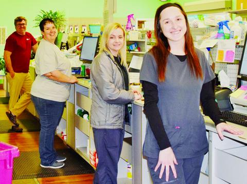 Robbinsville Pharmacy is one of several businesses in Graham County that has stayed opened throughout the COVID-19, making sure customers can still obtain essential products. Pictured from back is Robbinsville Pharmacy owner Mike Spinn, Wendy Millsaps, Chessney Flowers and Grace Millsaps. Photos by Art Miller/amiller@grahamstar.com