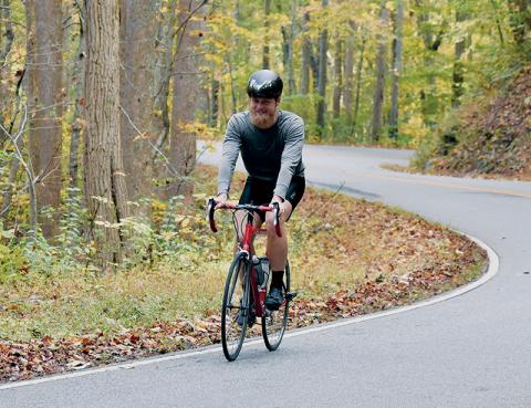 Fontana Dam resident Jon Hodgson was all smiles Monday morning, as he trekked up N.C. 28 to begin the second portion of a triathlon. Photos by Kevin Hensley/editor@grahamstar.com