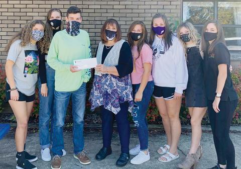 The Robbinsville High School Student Council raised and donated $100 toward the purchase of the food truck for Graham County Schools. From left in the photo is Robbinsville Student Council members Lina Pagan, Lindsey Brittain, Student Body President Dalson Jordan, Graham County Schools Superintendent Angie Knight, Ally Ayers, Ivy Odom, Caylin Lunsford and Keylie Jordan.