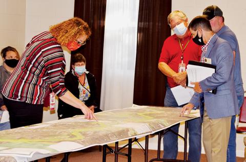 N.C. Department of Transportation, Division 14 representatives Wanda Austin, Dirk Cody and Brian Burch (clockwise, from left) address a question raised by Stecoah resident Jamie Lail at Tuesday’s Corridor K public hearing. Photos by Art Miller/amiller@grahamstar.com