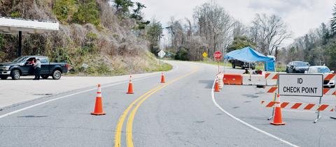 In this March 29 photo, Graham County Deputy Jim Hyde (left) and Graham County Land’s Quinn Carver help man one of the five entry points into the county, which were closed to non-residents in the wake of the COVID-19 outbreak. Photo by Art Miller/amiller@grahamstar.com