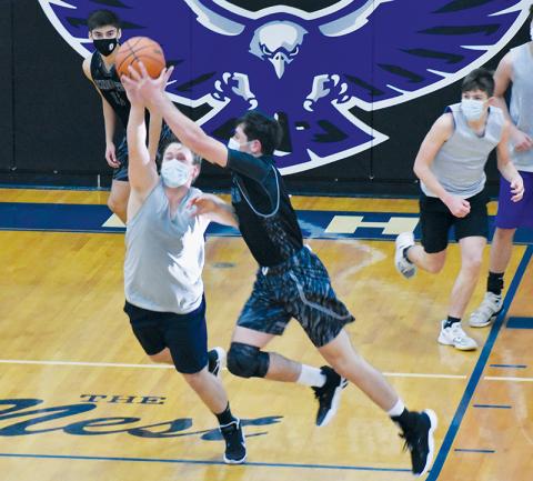 Robbinsville’s Nathan Collins plucks a steal away from Hiwassee Dam’s Michael Simms during a preseason scrimmage Saturday. Photos by Kevin Hensley/editor@grahamstar.com