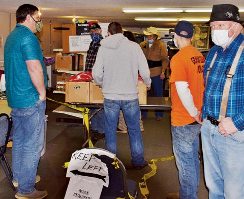 Workers assemble supplies during the final Graham Emergency Food Bank distribution on Dec. 30. Photo by Art Miller/amiller@grahamstar.com