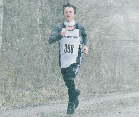 Members of the Robbinsville cross country team – including sophomore Hayden Stewart – had to deal with heavy snowfall and sub-freezing temperatures to  compete in Saturday's 1A Western Regional Meet in Bryson City. Photos by Kevin Hensley/editor@grahamstar.com