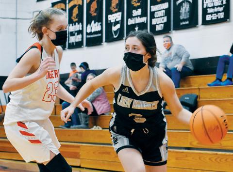Gabby Hooper cuts around Rosman’s Alissa Cheek on a drive to the basket Friday at Rosman. Hooper finished the game with 15 points. Photos by Kevin Hensley/editor@grahamstar.com