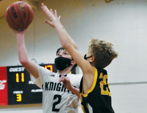 Robbinsville Middle School’s Roman Jones eyes a basket during a home game against Murphy on Jan. 25. Photo by Kevin Hensley/editor@grahamstar.com