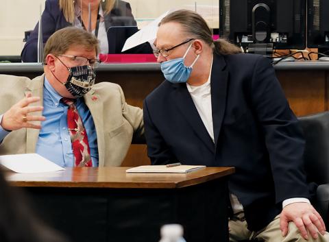 Defense attorney Rich Cassady (left) speaks with his client, Jackie Slaughter, at trial last week in the Cherokee County Courthouse. Photo courtesy of Quintin Ellison Photography