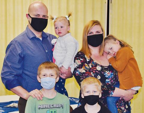 Jake Shamblin was joined with daughter Thea, wife Mallory and daughter Phoebe (back row); plus sons Levi and Noah during his introduction as the new regional Guardian ad Litem supervisor on Friday. Photo by Art Miller/amiller@grahamstar.com