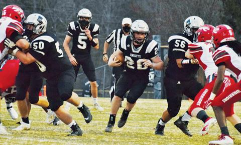 Linemen Candler Edwards (50) and Carlos Wesley (56) create an opening for running back Lex Hooper during Friday’s home game against Erwin. Hooper had three touchdowns in the first half. Photos by Art Miller/amiller@grahamstar.com