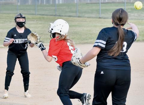 Robbinsville Middle School’s Dreylee Webster (13) and Sydney Adams have Andrews’ Alaina Flowers caught in a rundown during Tuesday’s road opener against the Lady Wildcats. Adams would tag out Flowers to complete a 2-4-6-5-4 fielder’s choice moments later. Photo by Kevin Hensley/editor@grahamstar.com