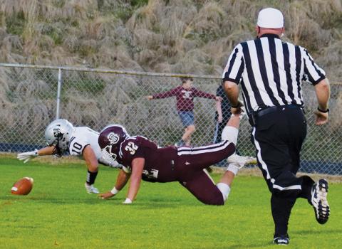 Wade Hamilton (10) stretches to recover Carson Taylor’s fumble in the end zone, during the first quarter of Friday’s road game at Swain County. The recovery set off a 38-point first half for Robbinsville, en route to a resounding victory over the Devils. Photos by Art Miller/amiller@grahamstar.com