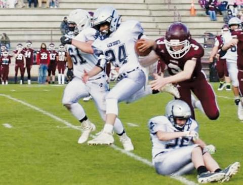Alexis Panama (24) evades a Swain defender during a carry in April 1’s game. Panama was named the Robbinsville Black Knights junior varsity MVP after April 8’s road finale at Rosman, which saw Robbinsville clinch a share of the Smoky Mountain Conference title. Photo by Miranda Buchanan/Robbinsville High School Yearbook