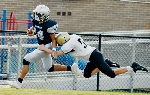 There was little Hayesville’s Adam Cook (5) could do to slow down the progress of Robbinsville’s Isaac Picon during the junior varsity Knights’ 68-0 win over the Yellow Jackets on March 24. Photo by Art Miller/amiller@grahamstar.com