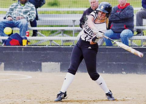 Taelyr Jackson prepares for a connection during Friday’s home game against Andrews. Jackson’s cut would result in an RBI for the Lady Knights. Photo by Miranda Buchanan/Robbinsville High School Yearbook