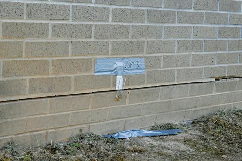 A crack monitor measures the expansion around the foundation of Robbinsville Elementary School’s gymnasium. The facility has been closed since late February, when Graham County School officials began to notice the floor was beginning to shift. Photos by Kevin Hensley/editor@grahamstar.com