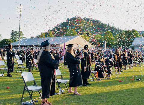Robbinsville High School graduates begin celebrating their achievement at the end of Sunday’s commencement. For more photos from the evening, see page 3. Photos by Art Miller/amiller@grahamstar.com
