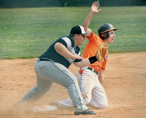 Despite the pleas of Rosman’s Andrew Stamey, Robbinsville’s Hunter Jones swipes up after applying the tag on a 2-5 caught stealing Tuesday, which ended the bottom of the first. The Knights went on to drop the game to the Tigers, 6-1. Photo by Kevin Hensley/sports@grahamstar.com