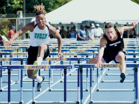 Brock Adams (right) bested North Rowan’s Tsion Delaney by 0.10 seconds to win the 110-meter hurdles state championship Friday at N.C. A&T University in Greensboro. Photo by Kevin Hensley/sports@grahamstar.com