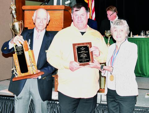 Robbinsville’s Nathan Collins was named the Keller Ferrell Division II Male Athlete – Major Sport Award winner at Sunday’s Mountain Amateur Athletic Club WNC Sports Awards Banquet in Asheville. Receiving the award on Nathan’s behalf was his father, Michael. With Michael is Mountain Amateur Athletic Club Board of Directors members David Cappiello (left) and Ann Brandis. Photos by Kevin Hensley/sports@grahamstar.com