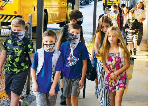 Students returned for the first day of the school year at Robbinsville Elementary on Aug. 16, under the district’s “optional” mask policy. Photo by Art Miller/amiller@grahamstar.com