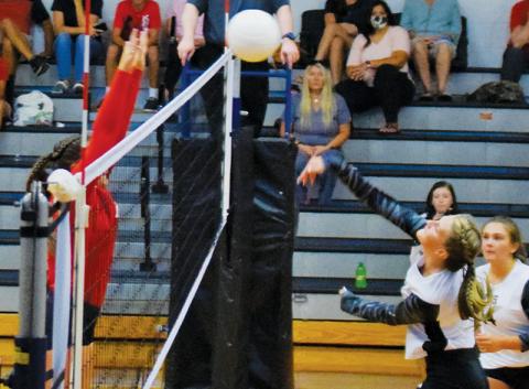 Kelsey Waldroup sends a shot back into Franklin territory during Monday’s season opener against the Lady Panthers. Robbinsville would prevail in a five-set battle. Photos by Art Miller/amiller@grahamstar.com