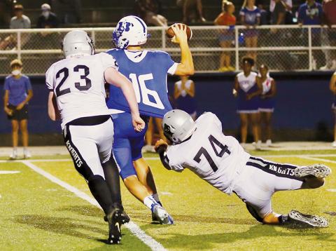 Briley Tolbert (23) and Ben Wachacha (74) close in on Brevard quarterback Anson Burgess during Aug. 27’s road game. Robbinsville has not played since the 15-14 loss, but will suit up for a trip to Tennessee on Friday. Photo by Miranda Buchanan/Robbinsville High School Yearbook