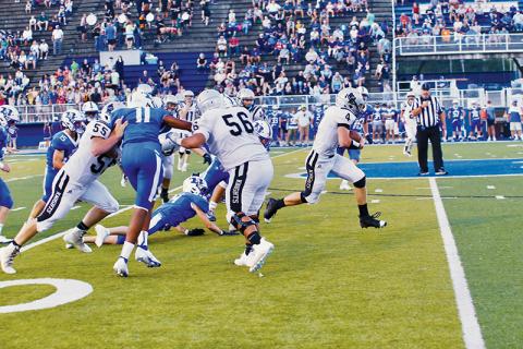 Cuttler Adams (4) breaks through the pack during Friday’s game at Brevard. Adams scored both of Robbinsville’s touchdowns in a 16-15 loss to the Blue Devils. Photo by Miranda Buchanan/Robbinsville High School Yearbook
