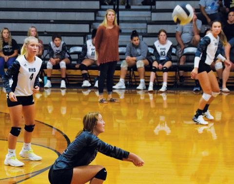 With Kensley Phillips (4) and Delaney Brooms (1) looking on, Robbinsville’s senior libero Halee Anderson digs the ball out on back-row defense during the Aug. 23 home match against Smoky Mountain. Before sports were paused district-wide until Sept. 13, the Lady Knights compiled a 6-0 record in non-conference play. Photo by Art Miller/amiller@grahamstar.com