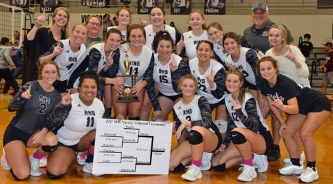 The Robbinsville Lady Knights gather in celebration, moments after defeating Murphy in four sets Wednesday night to win the 2021 Smoky Mountain Conference tournament. Photo by Art Miller/amiller@grahamstar.com