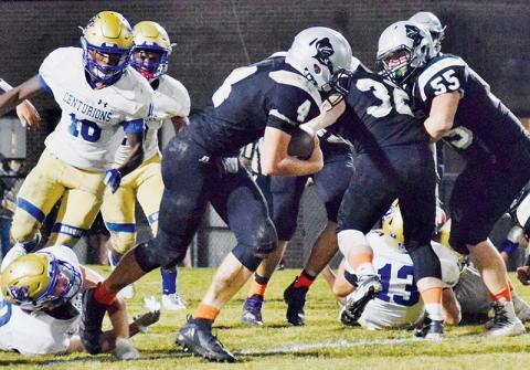 Robbinsville sophomore Cuttler Adams (4) escapes the clutches of a Centurion defender Friday night. Adams had four touchdowns and a two-point conversion in the Knights’ 46-43 loss to Broome, S.C. Photo by Art Miller/amiller@grahamstar.com