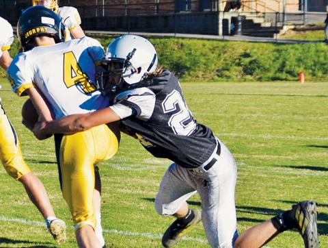 Andrew Adams wraps up Murphy’s Will Shore during Robbinsville’s loss to the Bulldogs on Sept. 23. Photo by Art Miller/amiller@grahamstar.com