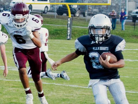 Junior varsity Black Knight Adair Panama sprints away from the Swain County defense during the Oct. 14 season finale. Photo by Art Miller/amiller@grahamstar.com