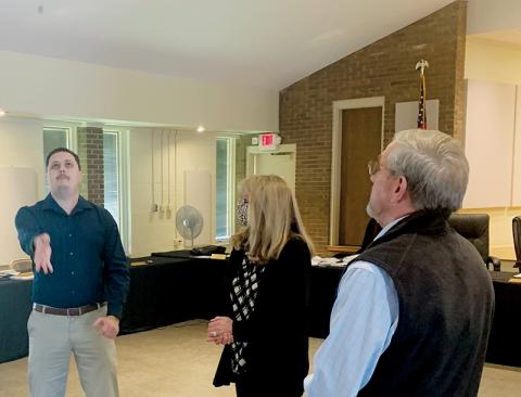 Graham Star publisher/editor Kevin Hensley (left) was selected to flip the coin that would break the tie for a seat on the Town of Lake Santeetlah council at Tuesday’s Graham County Board of Elections canvassing meeting. Observing the flip are election board chairman Juanita Colvard (center) and Town of Lake Santeetlah mayor Jim Hager. Photo courtesy of Beefy Rogers/Contributing Photographer