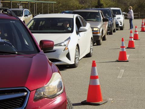 Cars queue up at a mass vaccine clinic held Saturday in Robbinsville. The event was the largest of its kind held in the county to date, and saw 248 people take the vaccine. Photo by Charlie Benton/news@grahamstar.com